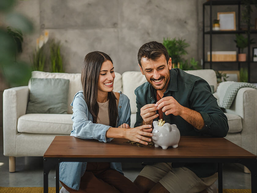 Couple With Piggy Bank